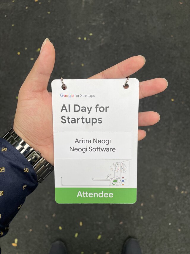 Aritra Neogi holding Google AI Day for Startups identity card representing Neogi Software