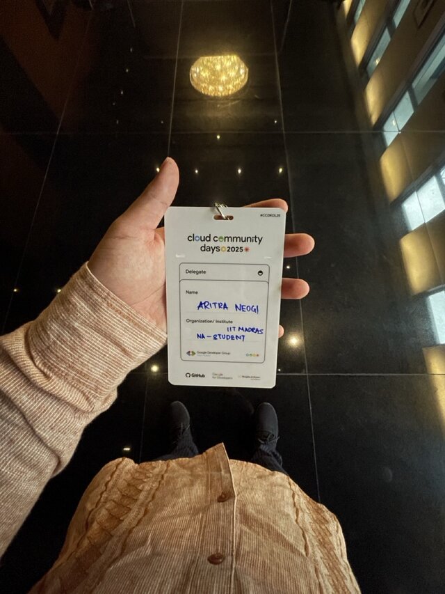Aritra Neogi holding Google Cloud Community Days Kolkata 2025 identity card being a student of IIT Madras