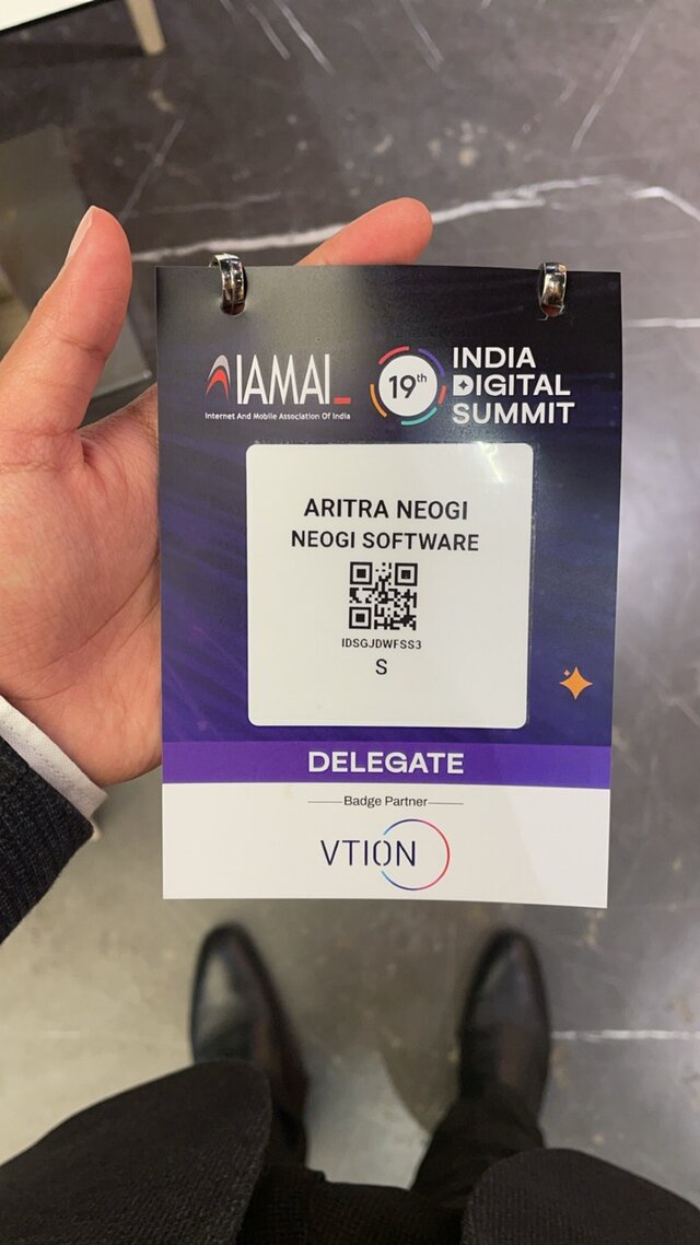 Aritra Neogi holding the Delegate identity card
